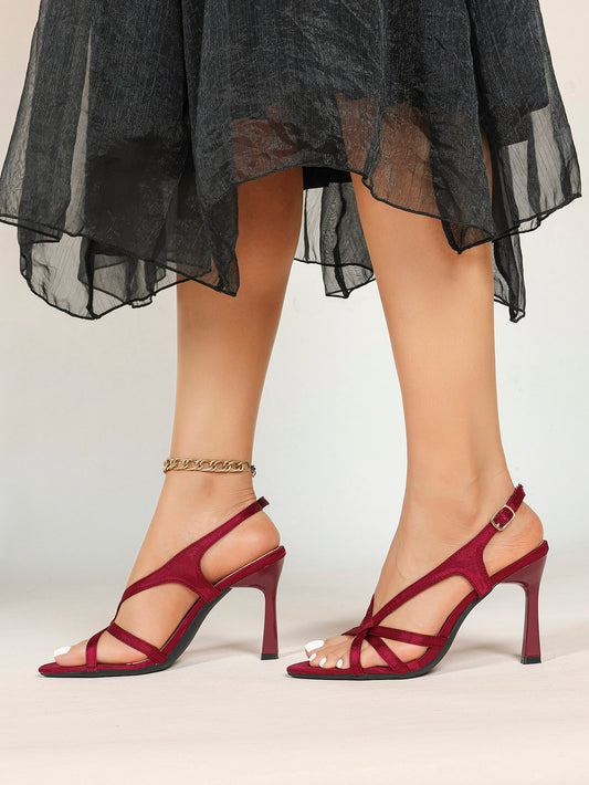 Burgundy satin slingback sandals worn with black dress – full look